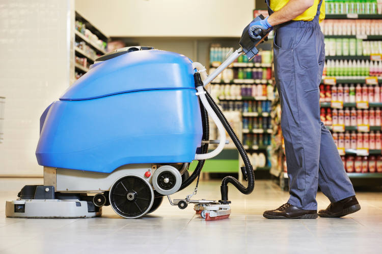 Worker cleaning floor with machine - Depositphotos_30415231_XL